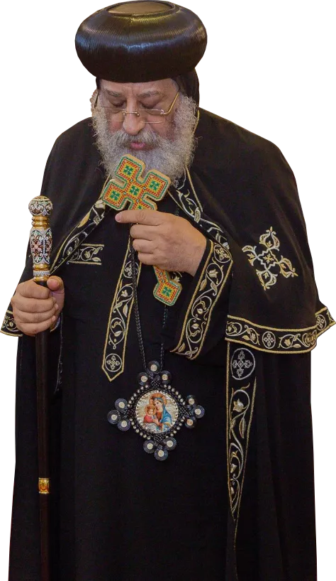Pope Tawadros praying, holding a cross